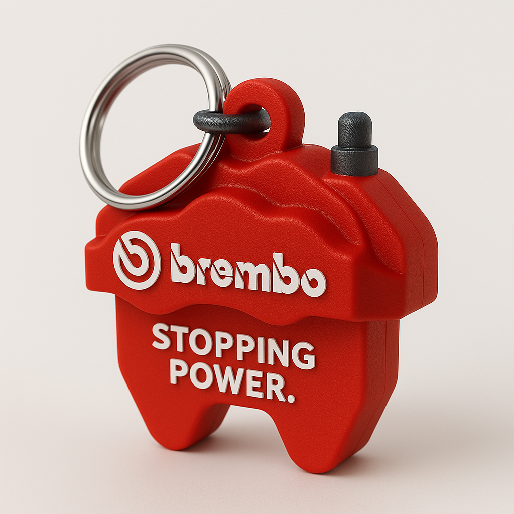 Portachiavi 3D personalizzato a tema Brembo, ispirato a un disco freno sportivo, con forme reali e scritta integrata.